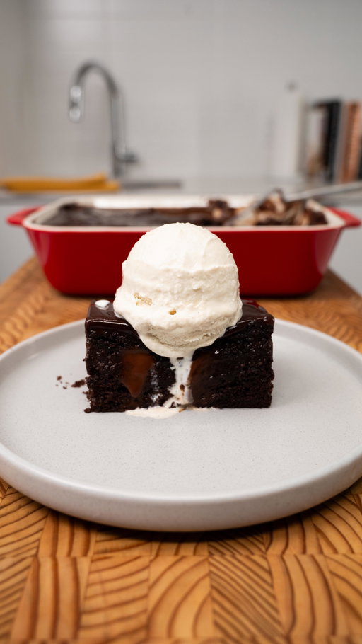 Hot Chocolate–Soaked Chocolate Cake
This cake borrows the soaking technique of tres leches and applies it to hot chocolate. With the magic ingredients of local milk, cream and butter the result is an extremely moist chocolate cake that absorbs a rich cocoa soak and finishes with a smooth chocolate ganache.
Ingredients
3 large eggs
1 cup Ontario 2% milk
¾ cup unsalted Ontario butter, melted and slightly cooled
1 cup granulated sugar
1½ cups all-purpose flour
¾ cup unsweetened cocoa powder
1 tablespoon baking powder
1 teaspoon baking soda
Method
Preheat oven to 350°F (175°C). Butter and line a baking pan.

In a large bowl, whisk eggs, milk, sugar, and melted butter until completely smooth.

Place a fine-mesh sieve over the bowl and sift in flour, cocoa powder, baking powder, and baking soda.

Whisk gently until the batter is smooth and lump-free.

Pour batter into the prepared pan and bake for 30–35 minutes, until a toothpick comes out with moist crumbs.

While the cake is still warm, poke holes evenly across the surface using a skewer or chopstick.

Hot Chocolate Soak
Ingredients
2 cups Ontario 2% milk
1 cup granulated sugar
1 cup unsweetened cocoa powder
2 tablespoons unsalted butter
1 teaspoon vanilla extract
Method
Combine milk, sugar, and cocoa powder in a saucepan.

Bring to a gentle simmer over medium heat, whisking constantly, until thick and glossy.

Remove from heat and whisk in butter and vanilla until fully incorporated.

Slowly pour the hot chocolate over the warm cake, allowing it to soak in gradually.

Let the cake rest until all liquid has been absorbed.

Chocolate Ganache Topping
Ingredients
7 oz semi-dark chocolate, chopped (about 1¼ cups)
¾ cup heavy cream
Method
Add chocolate and cream to a stainless steel bowl.

Place the bowl over a pot of gently simmering water.

Stir occasionally until fully melted, smooth, and glossy.

Pour or spread over the soaked cake and let set slightly before serving.
Serve slightly warm or fully chilled. The cake should be intensely moist, rich, and almost pudding-like.

#inspiredbydairy #easyrecipes #hotchocolatecake