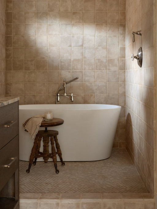 We chose these limestone tiles from @villalagoontile to ground the primary bath at our Canyon project in warmth and calm. Bathrooms should feel restorative above all else. By pairing a sculptural soaking tub with a rain shower, we were able to create a multifunctional, spa-like retreat that fully maximizes the space. Soft, understated tones layered with beautiful materials that feel timeless. A bathroom that’s understated in palette, yet rich in luxury. 

photos by @public311design