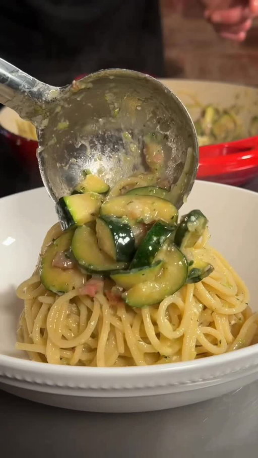 Quick and easy Pasta with zucchini and Guanciale 🍝

Ingredients (serving 3)   Pasta 400g 
2 average zucchini
Guanciale (or pancetta or bacon) 150g
Parmigiano reggiano 80g
Almonds an handfull 
Salt, Black pepper to taste 

1-) Start boiling a large pot of salted water for pasta 
2-) Cook the pork at high for a couple of minutes, no oil, no butter 
3-) Slice the zucchini
4-) Add half of the zucchini to the skillet with pork and boil the other half for 2/3 minutes
5-) Add the boiled zucchini to a food processor followed by Cheese, Almonds, Black pepper and olive oil. Add a couple of ice cubes to keep a bright-green color. 
6-) Cook the pasta 2 minutes under the package cooking instructions then dry it directly into the skillet.  Add a ladle of cooking water and stir at high until the water evaporates.  7-) Turn off the heat and scoop in the zucchini cream, a little more cooking water, mix until uniform and creamy and serve. 

👨‍🍳Feel free to twist the ingredients according to your taste. 
Use a different cheese, change the pepper quantity… 
Let your creativity run wild while cooking from scratch with fresh ingredients. That’s what Mediterranean diet is all about.