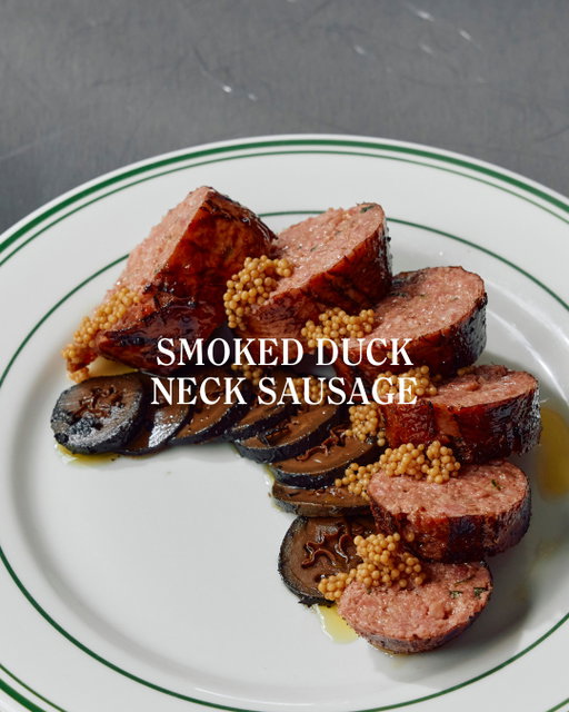 Pork farce, seasoned with fresh sorrel and pain d'épices, is stuffed into a duck neck, before being cooked and smoked. To prepare, grill on the BBQ or pan-fry, then serve with pickled mustard seeds (available in-store) and pickled walnuts.⁠
⁠
A hearty sausage, one is plenty for two people to share.⁠
⁠
→ Pre-order via the link in our bio.⁠