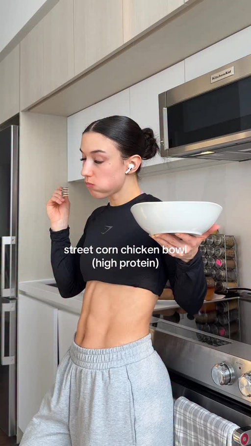 Street Corn Chicken Bowl (High Protein)
________
i may not be good with my words, but this bowl was 10/10 🙂‍↕️

Chicken:
Season 4 chicken thighs (about 100 g each) with:
- 1 tbsp extra-virgin olive oil
- 2 tsp paprika
- 2 tsp garlic powder
- 2 tsp oregano or Italian seasoning
- 1 tsp salt
- 1 tsp red chili flakes
- Juice of ½ lime

Mix well and marinate in the fridge for 30–60 minutes.

Air-fry at 390°F (200°C) for 12 minutes, flip, then cook for another 5 minutes or until fully cooked and crispy. Remove from heat and slice into strips.

Creamy Sauce:
In a bowl, combine:
- ½ cup sour cream
- ⅓ cup mayonnaise
- 1–2 tsp Tajín (to taste)
- Juice of 1 small lime
- Salt and pepper, to taste

Mix until smooth and creamy.

Street Corn:
Heat a pan over medium-high heat and add:
- 1 tbsp extra-virgin olive oil
- ½ red onion, finely chopped
- 1 jalapeño, deseeded and finely chopped
- 1 cup corn

Cook, stirring occasionally, until the corn is lightly charred. Remove from heat and let cool slightly. Stir in ½ of the creamy sauce until well combined.

Assemble: 	Add cooked rice to the bowl as your base. Top with sliced chicken, street corn mixture and sliced avocado. Drizzle some of the sauce on top.