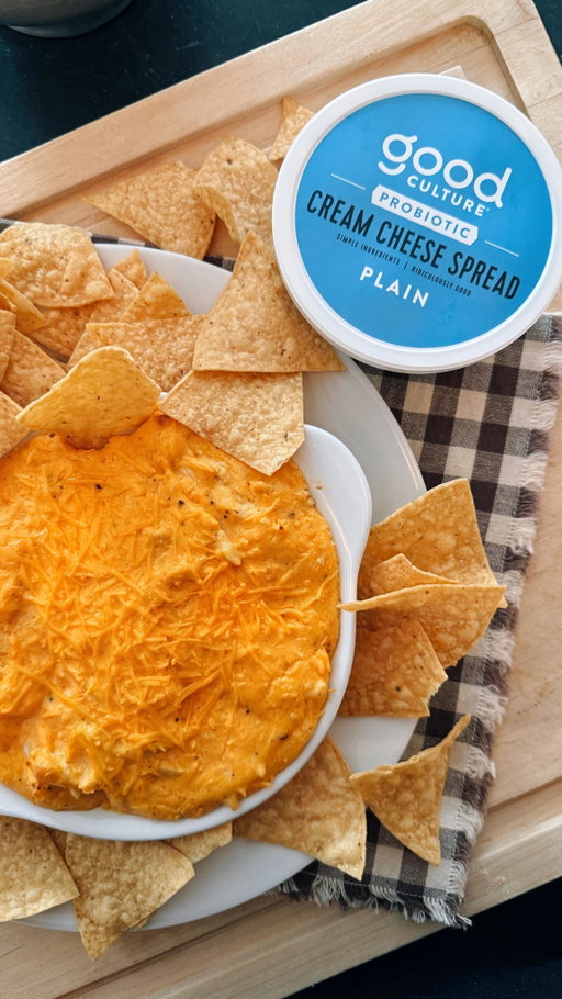 she’s hot. she’s creamy. she’s invited.

Buffalo Chicken Dip

Ingredients:
• 8 oz Good Culture Cream Cheese, softened • 1 cup shredded cooked chicken • ½ cup buffalo sauce • ½ cup shredded sharp cheddar • ¼ cup shredded mozzarella (optional but for cheese pull)
• 1 small garlic clove, finely grated • 1 tbsp melted butter • 2–4 tbsp milk or cream (for loosening) • Freshly cracked black pepper • Scallions or chives 
Method:
1. Fold together the softened Good Culture Cream Cheese with melted butter, garlic, and black pepper. 2. Mix in the buffalo sauce until fully incorporated. 3. Fold in chicken, cheddar, and mozzarella. Add milk or cream a tablespoon at a time until creamy but thick and scoopable. 4. Transfer to a small baking dish or cast iron. Bake at 375°F for 18–22 minutes, until bubbling and lightly golden. Finish with scallions or chives.