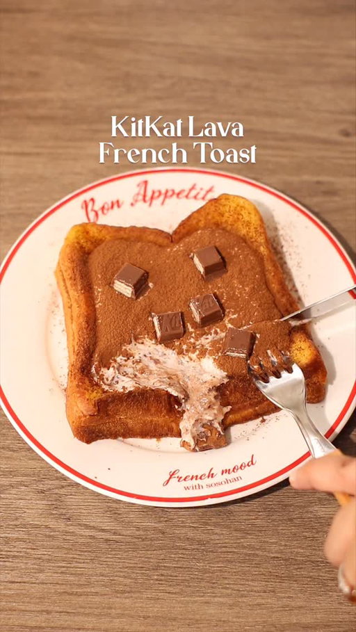 🍫🍞 Kit Kat Lava French Toast

📝 Recipe

2 Slices • Bread
10g • Condensed Milk
1 Egg
30ml • Milk
1 tbsp • Butter
Cocoa Powder

KitKat Cream 🥛:
1 Pack • KitKat Chocolate Bar
25g • Whipping Cream
25g • Milk

Instructions:

• Bread
- spread condensed milk on bread and stack another bread on top

• French Toast Mixture
- in a bowl, crack open 1 egg, pour milk
- whisk to mix
- dip / coat the bread in the egg mixture

• Cooking; Bread
- heat the pan with butter in medium heat
- once the butter melted, turn the stove into low heat
- fry the bread that has been coated with the egg mixture until both sides turn into golden brown

• Kit Kat Cream
- in a jug, crush kit kat chocolate
- pour whipping cream and milk
- mix with hand mixer / milk frother

• Finishing; KitKat Lava French Toast
- flatten the bread / french toast in the middle to create space for the cream
- pour kit kat cream onto the bread
- dust cocoa powder and put more kitkat chunks on top then enjoy!

//

Easy recipe at home with IC! 🍞👩‍🍳

So far this is the best lava toast I have ever made, this is the winner y’all!! 🤤 I think the cocoa powder plays the big role in this recipe, it gives that slightly bitter taste over the sweet toppings and creams!

Do you guys like the cream thick or runny? I like it this way which is thick. If you want the cream to be more runny, put more milk than the whipping cream 👌

—

#asmr #homecafe #breadrecipe #frenchtoast #chocolatelover