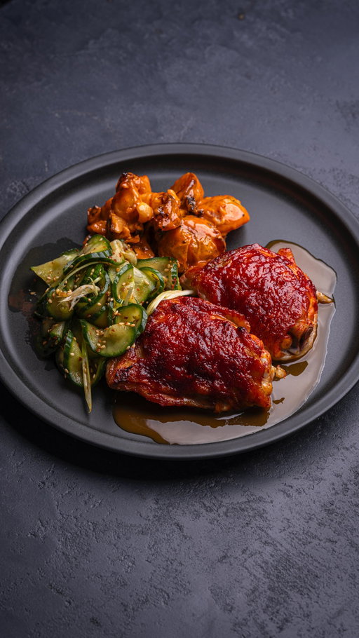 Gochujang chicken thighs with pickled cucumber and gochujang crispy potato salad.

Find the full recipe on eatlikeanadult.com (clickable link in bio)