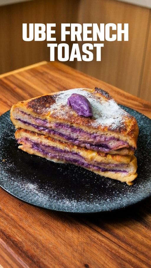 Ube French Toast 💜🍞

A fun take on classic French toast with a Filipino twist.

I love the idea of stacking things in layers and this feels a little extra, a little unique, and you get ube in every single bite.

Thin slices of bread work best so you can spread the ube in between. Once stacked, it gets soaked in an egg mixture and pan-fried in butter until golden on the outside and soft all the way through.

Soft, buttery, packed with ube. Perfect for breakfast, brunch, or even merienda.