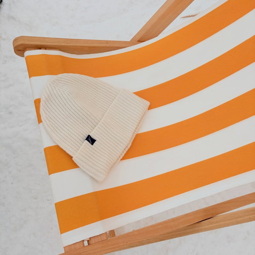 It’s not sand it’s snow. Nothing but the best for the snow finally coming down out west! 100% cashmere beanies.