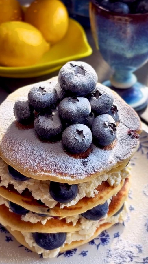 Pancake Day, but make it premium 🫐✨
This dreamy blueberry lemon ricotta pancake stack is pure sunshine on a plate, packed with whole, plump @fruitistgoberry blueberries in every bite.

I folded the blueberries straight into the batter and tucked even more between each layer for a delightful crunch, bold flavour and vibrant colour throughout.

Designed for snacking but just as perfect for elevated recipes like this, Fruitist GoBerry is setting a new standard for blueberries - larger, flavour-forward and satisfyingly crunchy.

Exclusively available in Whole Foods Market UK, these are your go-to berries for a fresh take on Pancake Day indulgence.

Recipe 👇

Lemon Blueberry Ricotta Pancakes 🫐🍋🥞

Ingredients: 
250 g all-purpose flour
1/2 tsp baking soda
1 tbsp baking powder
2 tbsp caster sugar
1/8 tsp salt
1 tsp vanilla extract
235 ml milk
2 eggs
125 g ricotta cheese
Zest of 1 lemon
2 tbsp lemon juice
200g Fruitist GoBerry blueberries + more for serving
Sweetened whipped mascarpone cream, 
Icing sugar & maple syrup for serving

Instructions: 
1. In a large bowl, whisk together the flour, baking soda, baking powder, sugar and salt. Set aside.
2. In a separate bowl, whisk together the ricotta, lemon zest, eggs, vanilla extract, lemon juice and milk. 
3. Add the wet ingredients to the flour mixture and gently whisk until well incorporated. Fold in the blueberries.
4. Pour a few tablespoons of batter onto a medium-hot pan and cook for about 3 minutes, until the edges begin to firm. Flip and cook for another 1–2 minutes. Repeat with remaining batter.
5. Stack pancakes with alternating layers of sweet mascarpone cream and fresh whole blueberries.
6. Dust with icing sugar and finish with a generous drizzle of maple syrup.

#PancakeDay #blueberries #pancakes #foodie #recipe