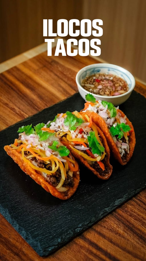 What if we turned Ilocos Empanada…. into a Taco? 🌮🔥

What I really love about this version is the fresh elements. Since it’s open face, you can actually play around with the toppings a bit more. I didn’t change much, just swapped the usual cooked papaya for atchara so you get that sharp, pickled bite. Everything else stays pretty true to the original, except for the raw onions and coriander to brighten it up.

The shell is still my favorite part. Super crispy, holds its shape, and gives that signature crunch that makes Ilocos empanada so special. And of course, the longganisa is the real flavor bomb here. Garlicky, savory, and bold.

Same soul, just fresher and a little more fun.