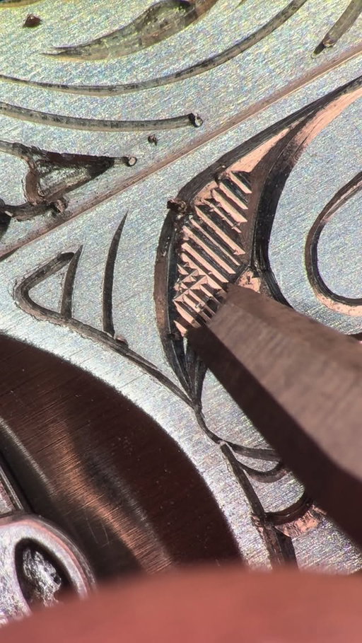 Engraving of the Rolex clasp - stage two. A few days into the work, a much sharper chisel comes into play, and the lines become noticeably shinier and crisper. 
.
.
.
.
.
#watches #watchmaking #watchfam #watch #engravedwatch