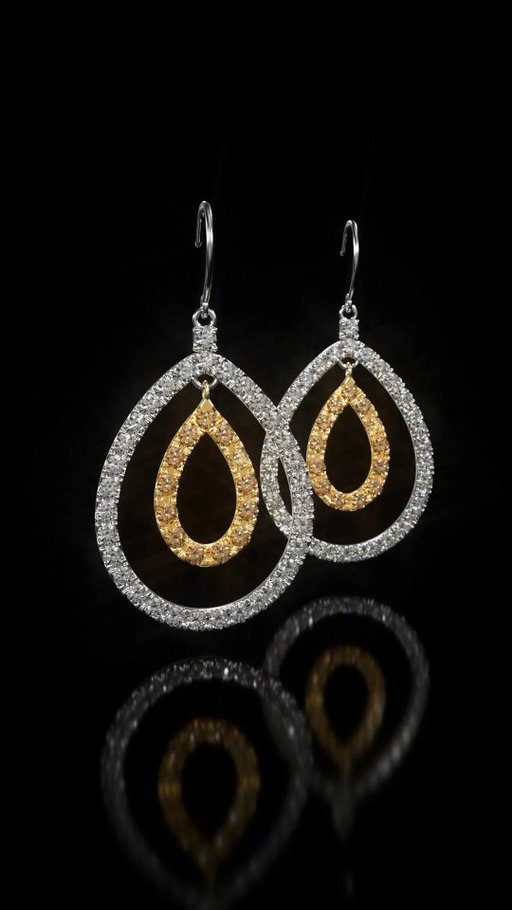 Harmony and light. Double pear-shaped drop earrings featuring yellow and white brilliant-cut diamonds.

#HumbertownJewellers #Toronto #luxury
