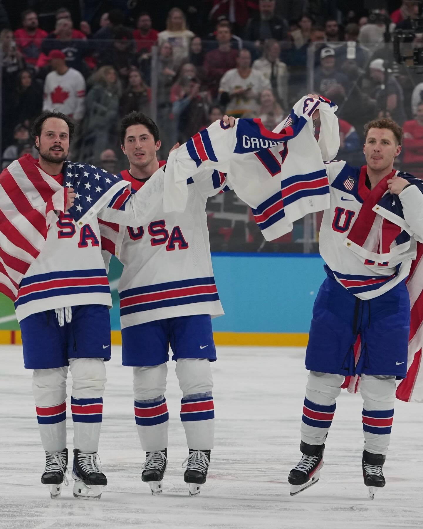 Team USA holds up Johnny Gaudreau’s jersey after Gold. This is what sports are all about. ❤️🇺🇸