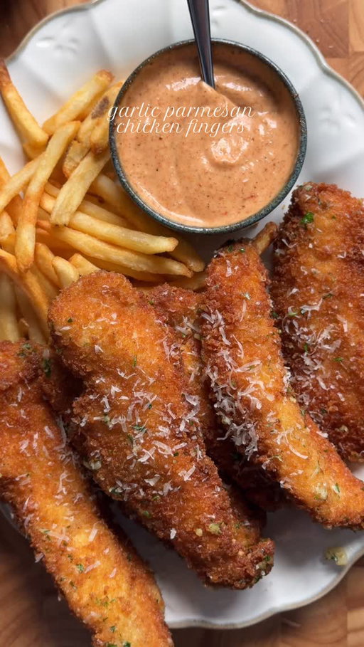 Crispy Garlic Parmesan Chicken Strips with Creamy Chili Sauce 🍗

Ingredients:

For the Chicken:
2 lb chicken breast, cut into strips
Salt to taste
1 tbsp garlic powder
1 tsp black pepper powder
Oil for frying

For the Dry Batter:
2 cups all-purpose flour
Salt to taste
1 tbsp garlic powder
1 tsp black pepper

For the Egg Mixture:
3 eggs

For the Breadcrumb Coating:
2 cups panko breadcrumbs

 For Garlic Parmesan Butter:
1/2 cup butter
4-5 cloves fresh garlic, finely chopped
2 tbsp freshly chopped parsley
1 cup Parmesan cheese, freshly grated

For the Sauce:
1/2 cup mayonnaise
2 tbsp ketchup
1-2 tbsp chili sauce (adjust to taste)
1/2 tbsp Dijon mustard
Salt to taste
1 tsp smoked paprika powder
1 tbsp garlic powder
1 tsp black pepper powder

Method:

Season the Chicken: Sprinkle salt, garlic powder, and black pepper powder over the chicken strips. Mix well to ensure even coating.

Prepare the Dry Batter: In a bowl, mix together flour, salt, garlic powder, and black pepper.

Prepare the Egg Mixture: Beat the eggs in a separate bowl.

Prepare the Breadcrumb Coating: Place panko breadcrumbs in another bowl.

Coat the Chicken: Dip each seasoned chicken strip into the flour mixture, then the egg mixture, and finally the breadcrumb mixture, ensuring an even coat.

Fry the Chicken: Heat oil in a deep frying pan over medium-high heat. Fry the coated chicken strips until golden brown and crispy. (for about 5-6 minutes flipping sides in between )

Make Garlic Parmesan Butter: In a pan heat butter once melted add minced garlic. Sauté for 1 min until fragrant. Remove and set aside 

Prepare the Sauce: In a bowl, combine mayonnaise, ketchup, chili sauce (to taste), Dijon mustard, salt, smoked paprika powder, garlic powder, and black pepper powder. Mix well.

Serve:Toss the fried chicken strips with garlic butter. Top it with freshly grated Parmesan cheese and freshly chopped parsley. Serve with creamy chili sauce for dipping.

#chickentenders #recipe #garlicparmesan