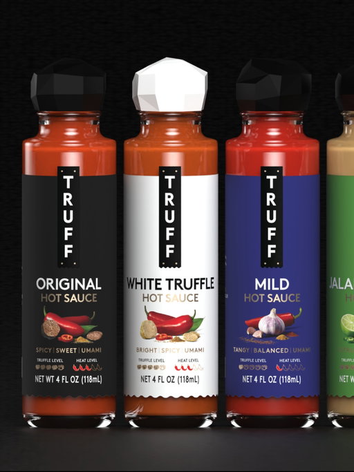 After 8+ years of our original design, today we unveil a new look for TRUFF — a more expressive front panel that puts our flavor story front and center.

Now featuring ingredient imagery, descriptive flavor notes and truffle and heat meters, to show what’s inside before it ever hits the plate.

Our all-black, iconic truffle-shaped caps signify the inclusion of rare black truffle, while our white truffle caps signify the inclusion of the ultra luxe white truffle. 

Same obsession, sharper expression.

TRUFF is the ultimate culinary flex that makes every meal craveable.

Rolling out nationwide over the coming months.