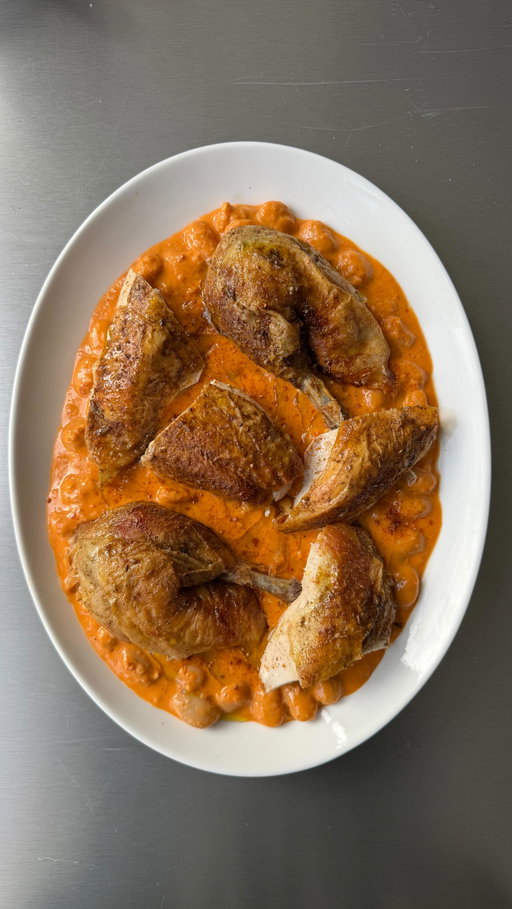 crispy fennel roasted golden chicken placed on top of silky, tomatoey vodka beans. a proper centre-of-the-table moment and honestly feels like the bean and chicken dish to end all bean and chicken dishes. creamy, a little bit boozy and wildly comforting. serve it up, watch everyone go quiet 🫘

For 2
1 whole chicken (about 1.5kg)
3 tbsp fennel seeds
2 tbsp dried oregano
1 tbsp flaky salt
1 shallot , finely chopped
4 garlic cloves, crushed 
1 tsp chilli flakes
2 tbsp tomato paste
80ml vodka
1x 500g jar butter beans with their liquid or 150ml chicken stock if using tinned
60ml double cream
50g parmesan

1. Heat oven to 180°C fan. Grind the fennel seeds, oregano & salt into a fine dust
2. Rub the chicken all over with olive oil, then coat generously in the fennel-oregano dust. Roast in a tray for 1 hr 25 mins. Rest for 15 mins, then carve into chunky pieces.
3. While the chicken rests, start the beans. Heat a big glug of olive oil in a wide pan, soften the garlic & shallots for 5 mins.
4. Add the chilli flakes, stir in tomato paste and cook until darkened and jammy, 2–3 mins. 
5. Pour in vodka, let it bubble and reduce by half then add beans with their liquid, simmer for 5 mins then stir in cream and parmesan and season to taste.
6. Spoon the creamy vodka beans onto a big platter and nestle the carved roast chicken over the top. Finish with a drizzle of olive oil.