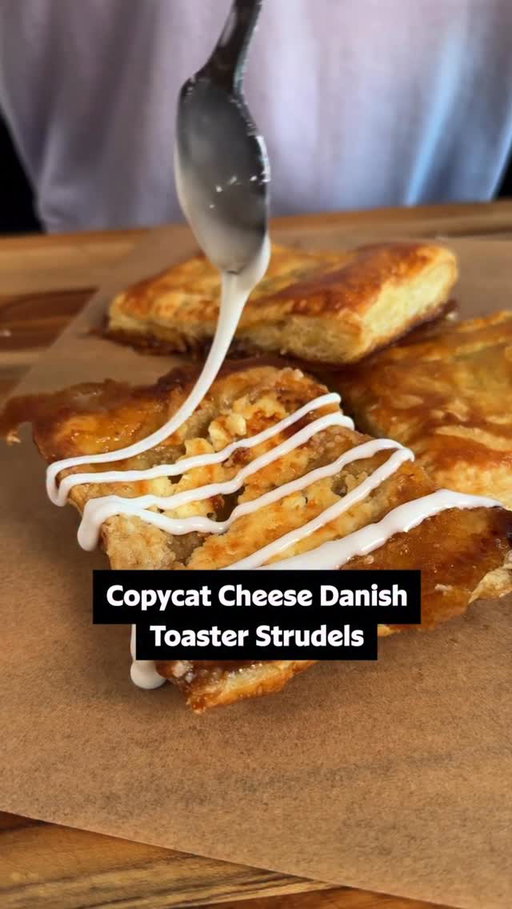 The flavor of these Copycat Cheese Danish Toaster Strudels is better than anything you could find in the frozen aisle. 🤤 Get the full recipe below or in the @allrecipes bio! ⬇️

Ingredients: 
6 ounces cream cheese
4 tablespoons butter 
6 tablespoons brown sugar
1 sheet puff pastry
1 large egg, beaten
1 cup confectioners sugar
1 tablespoon milk, plus more as needed

Directions: 
Place cream cheese in the freezer for 15 minutes before preparation. 

Preheat the oven to 400 degrees F (200 degrees C). Line a baking sheet with parchment paper. 

Slice butter into 12 slices. Place 2 slices vertically in 6 sections on the prepared baking sheet. Top each set of butter slices with 1 tablespoon brown sugar. 

Slice partially frozen cream cheese into 12 slices. Set 2 slices side by side on top of brown sugar sections. 

Lightly roll puff pastry on a lightly floured surface.  Cut pastry sheet into 6 rectangles.  Press pastry around each mound of cream cheese mixture, pressing slightly down on the cream cheese.  Use a fork to crimp the edges of each pastry. Brush pastries with beaten egg.

Bake in the preheated oven until golden brown and flaky, 15 to 18 minutes. Let stand on the baking sheet for 10 minutes before carefully turning over. 

Meanwhile, whisk together confectioner’s sugar and milk until smooth. Drizzle desired amount of icing over pastries. 

✨ Inspired by @groarkboysbbq 
🎥: Nicole @nicolemcmom

#baking #cheesedanish #easyrecipes