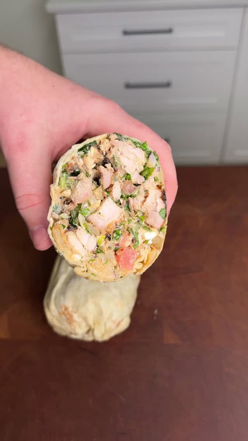 Chopped Chicken Gyro Wraps with @kingsford. These were so good!

Chicken Marinade (marinade for a minimum of 1 hr)
6-8 boneless chicken thighs
2 tbsp olive oil
4 tbsp Greek yogurt
2 tbsp lemon juice
2 tsp of each: salt, pepper, oregano, parsley, paprika, red pepper flakes, garlic & onion powder

Fire up the grill using @kingsford Original Charcoal to high heat (about 400-450°)
Grill the chicken till 165°, flipping periodically so it cooks evenly and gets a char on both sides
Let the chicken rest for 10 minutes before building your wrap
To a bed of lettuce, add chicken, French fries, tomatoes, red onions and feta
Start to chop until your desired consistency and then mix in homemade Tzatziki sauce 
Add it to a large tortilla, wrapping tightly and enjoy!