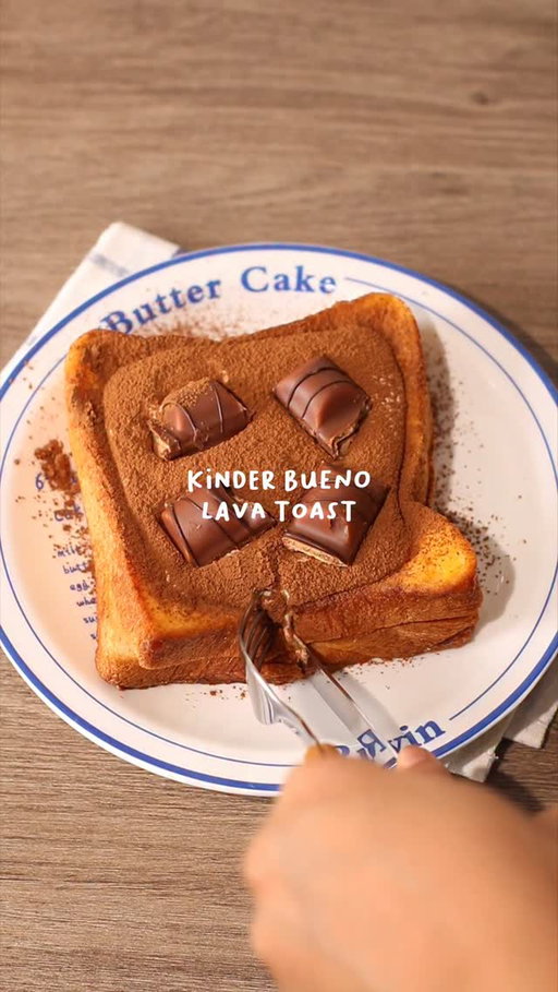 🍫🍞 Kinder Bueno Lava Toast

📝 Recipe

1 Egg
30ml • Milk
2 Slices • Bread
10g • Condensed Milk
1 tbsp • Butter
Cocoa Powder

Kinder Bueno Cream 🥛:
1 Pack • Kinder Bueno (leave some for toppings)
25g • Whipping Cream
25g • Milk

Instructions:

* French Toast Mixture
- in a bowl, crack open 1 egg, pour milk
- whisk to mix

* Bread
- spread condensed milk on bread and stack another bread on top
- dip / coat the bread in the egg mixture

* Cooking; Bread
- heat the pan with butter in medium heat
- once the butter melted, turn the stove into low heat
- fry the bread that has been coated with the egg mixture until both sides turn into golden brown

* Kinder Bueno Cream
- in a jug, crush kinder bueno
- pour whipping cream and milk
- mix with hand mixer / milk frother

* Finishing; Kinder Bueno Lava French Toast
- flatten the bread / french toast in the middle to create space for the cream
- pour kinder bueno cream onto the bread
- dust cocoa powder and put some more kinder bueno wafers on top then enjoy!

//

Easy recipe at home with IC 👩‍🍳🍞

I looove kinder bueno, so I decided to make one as lava toast! Using only 1 wafer is not that sweet, so I guess you can use a whole pack of kinder bueno for the cream and get another pack for the toppings! 

—

#asmr #chocolatelover #breadrecipe #frenchtoast #easyrecipes