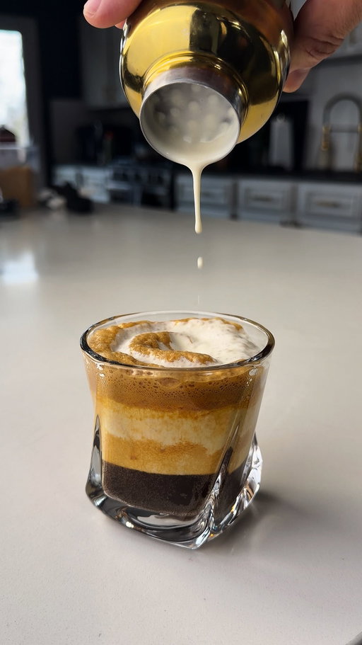 Part 5 of my viral shaken espresso series.
Cream Top Shaken Espresso.

RECIPE:�2 oz espresso�1 tbsp brown sugar�Pinch of salt�Ice

Cream Top:�2 oz heavy cream�½ oz maple or vanilla syrup�Pinch of salt

HOW TO:�Shake espresso, sugar, salt, and ice until cold and foamy.
Pour over fresh ice.
Lightly shake the cream mixture until thickened, 
then slowly layer it over the espresso for 
that signature floating cream finish.

Smooth. Balanced. Easily one of my favorites so far.

Save this and try it. Final part coming next.

#shakenespresso #creativecoffee #icedcoffeeathome #coffeeinspiration #homebaristalife coffeerecipe