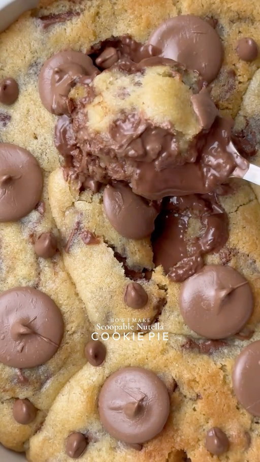 Ooey-Gooey Scoopable Nutella cookie pie🤤
Yields: 15-16 Chunky Cookies
INGREDIENTS:
230g Cold Chopped Unsalted Butter
160g Caster Sugar
160g Light Brown Sugar
450g Chocolate Chunks or chips
475g Plain Flour
1 tsp Salt
3 tsp Baking Powder
3/4 tsp Baking Soda
2 Eggs
1 Egg Yolk
1 tsp Vanilla
INSTRUCTIONS:
•Cut cling wrap into small squares. Scoop ½ teaspoon Nutella onto individual cling-wrap squares. Fold to seal and freeze until solid. (Repeat for however many Nutella stuffed cookies you plan to make.)
•In a large mixing bowl, add the cold cubed butter and whisk until slightly creamy. Add the white sugar and light brown sugar, then whisk together until well combined and fluffy.
•Add the eggs, vanilla extract, and chocolate chips or chunks. Whisk until fully incorporated.
•Add the flour, baking powder, baking soda, and salt.
Gently mix until just combined, do not overmix.
•Portion the dough into 90g balls. Press a frozen Nutella piece into the centre of each dough ball, seal well, and roll into a smooth ball.
•Place the stuffed cookie dough balls onto a tray and freeze for at least 30 minutes (or overnight for best results).
•Preheat oven to 180°C (350°F).
•Take any shape baking dish circle, square, rectangle anything and line it with parchment paper. Arrange frozen cookie dough balls in it leaving some space between them.
•Bake for 10-15 minutes (timing depends on the type of pan) or until the tops are lightly golden while the centres remain soft and gooey.
•Remove from the oven and let cool slightly.
•Serve warm with ice cream and chocolate sauce enjoy!✨
NOTE: Store any extra dough balls in an airtight container or freezer bag and freeze for later. Whenever a cookie craving hits, bake straight from frozen 🫶🏻

#cookie #chocolate #nutella #viral #fyp