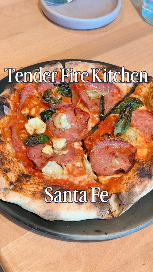 After five years of building a loyal following through pop-ups, Tender Fire Kitchen (@tenderfirekitchen) is opening its very first brick-and-mortar location in the Midtown District! I had the chance to visit during their soft opening, after eagerly watching the construction come together on social media for months.

Tender Fire Kitchen was created as a warm, welcoming gathering place centered around soulful food and genuine hospitality. Their menu features organic, locally sourced, seed-oil-free ingredients, with wood-fired sourdough pizzas offered with meat, vegetarian, vegan, and gluten-free options.

I ordered the Soppressata pizza, which was incredible! I planned on taking some home, but ended up finishing the whole thing. It paired perfectly with the Casita-Rita, which is like a classic margarita sweetened with honey! They also have a big wine selection, lots of local beers, and a full bar. 

I was also extremely impressed by how kid-friendly this space is! They have high chairs, silicone tableware to borrow, and coloring pages with crayons. They will also have a dog-friendly patio opening up when the weather is consistently warm. 

I have been a big fan of Tender Fire since their pop-up days, so seeing them open a permanent home here feels like a huge moment for the Santa Fe food scene.

Tender Fire Kitchen officially opens to their community on March 6th, and to the greater public on March 13, at 1025 Midtown Calle Central in Santa Fe, New Mexico, with reservations available soon on Resy. I believe they plan to be open Thursday through Monday from 5:00 to 9:00 pm. 

Share this with someone you want to try this new Santa Fe pizza spot with! #TenderFireKitchen #SantaFeNM #NewMexico