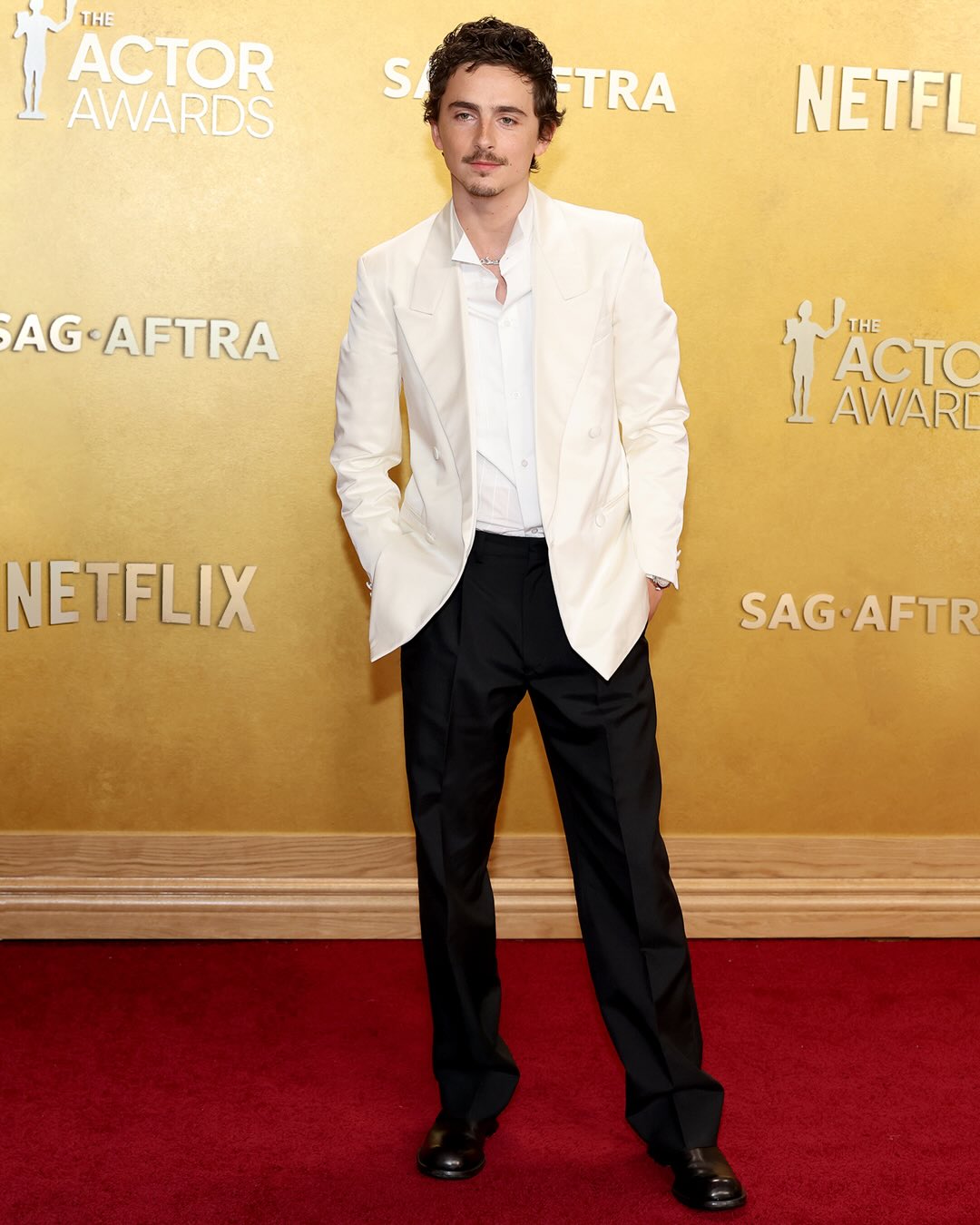 Timothée Chalamet, Prada Ambassador Damson Idris, Claire Danes and Adam Brody wore Prada while attending the 32nd Annual Actor Awards in Los Angeles, California on March 1, 2026.

@tchalamet, nominated for Outstanding Performance by a Male Actor in a Leading Role, wore a Prada white radzimir double-breasted tuxedo jacket with a pleated wing white poplin tuxedo shirt and black silk mohair trousers.

@damsonidris wore a Prada pinstripe mohair coat and trousers paired with a white cotton shirt and matching gilet. 

@clairedanes, nominated for Outstanding Performance by a Female Actor in a Miniseries or Television Movie, wore a Prada black pressed satin dress with white double satin collar, embellished by art déco-inspired embroidery. 

#AdamBrody, nominated for Outstanding Performance by a Male Actor in a Comedy Series, wore a Prada black mohair tuxedo with a bright yellow silk twill shirt. 

#PradaPeople #TimotheeChalamet #DamsonIdris #ClaireDanes