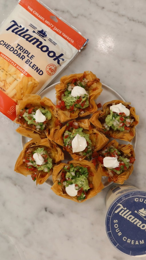 These Phyllo Dough Taco Bites are crunchy, cheesy, and packed with so much flavor. Using @tillamook Farmstyle Triple Cheddar Blend Shreds and Sour Cream helped bring these irresistible bites to life. #TillamookPartner
