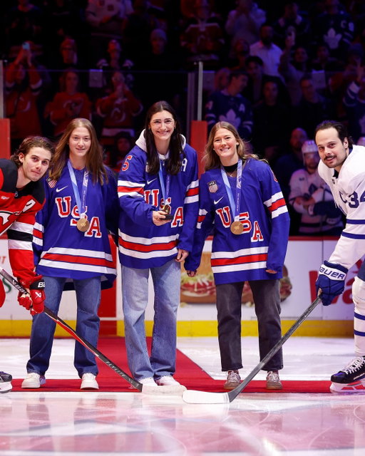 Olympic gold medalists @aerin.frankel, @megankeller4 and @haleywinn8 dropped the puck ahead of tonight's game between the @njdevils and @mapleleafs with @jackhughes and @austonmatthews taking the draw! 🥇
