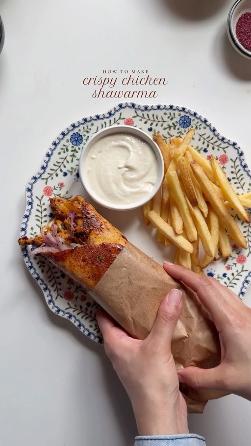 Crispy chicken shawarma 🌯

Ingredients 

For the chicken:

2 lb boneless chicken thighs, cut into pieces 
Salt to taste 
1 tsp black pepper 
1/2 tsp red chili powder 
1 tbsp smoked paprika powder 
1 tbsp garlic powder 
1 tsp cumin powder 
1/2 tsp coriander powder 
1/2 tsp turmeric powder 
1 tsp onion powder 
1 tablespoon lemon juice 
2 tbsp whole milk greek yogurt 
1 tsp red pepper paste
1 tbsp tomato paste 
2 tbsp oil ( for marinating ) + more for cooking the chicken 

For the garlic sauce:

1/2 cup mayonnaise 
3 tbsp sour cream
1 tbsp lemon juice 
2 cloves fresh garlic, minced
Salt to taste
1 tbsp olive oil

For the shawarma glaze:

1/2 cup oil 
1 tbsp red pepper paste or tomato paste 
1 tbsp sumac 
Pinch of salt
2 tbsp pomegranate molasses 

For the sumac onion:

1 red onion, thinly sliced
Squeeze of lemon juice 
1 tsp sumac
1 tbsp parsley, freshly chopped 
Salt to taste 
1 tbsp oil

To assemble 

6 thin pita bread 
1 cup tomato, seeded and diced
French fries

Method:

Marinade the chicken: In a bowl, combine chicken with salt, black pepper, red chili powder, smoked, paprika, garlic powder, cumin, coriander, turmeric, onion powder. Add lemon juice, Greek yogurt, red pepper paste, tomato paste, oil.  Mix well until the chicken is fully coated. Cover and marinate for at least 2 hours, or overnight.

Make sauce: In a bowl, whisk together mayonnaise, sour cream, lemon juice, garlic, olive oil, and salt until smooth. Refrigerate until ready to use.

For the glaze : Mix oil, red pepper paste, sumac, salt, and pomegranate molasses in a small bowl. Set aside.

For Sumac Onions: Combine sliced onion, lemon juice, sumac, parsley, salt, and oil. Toss well and set aside.

Heat oil In skillet over medium high heat. Add the marinated chicken and cook in batches for about 8–10 minutes until fully cooked and slightly charred.

Assemble the Shawarma: Take the pita wrap. Spread garlic sauce, add chicken, fries, sumac onions, fries and diced tomatoes.�Roll the pita tightly into a wrap. Toast it in a skillet for 1–2 minutes on each side. Then, coat the wrap with shawarma glaze and cook until it’s golden and crispy, serve warm.

#shawarma #recipe #crispyshawarma