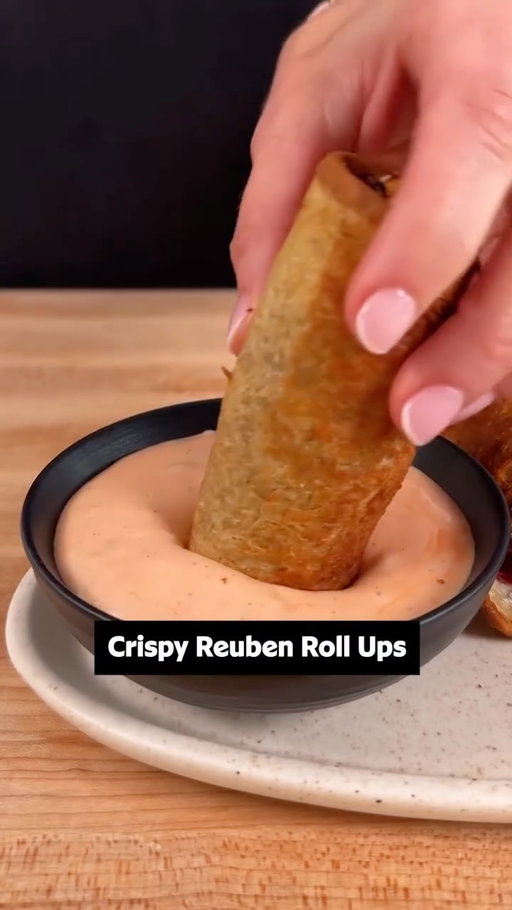 You’ve never had a reuben like this before. 🥳💚 Keep reading or get the full recipe details in the @allrecipes bio! ⬇️

Ingredients: 
12 slices soft rye bread
1 1/2 cups shredded Swiss cheese
1/2 pound very thinly sliced corned beef
3/4 cup sauerkraut, drained very well
1/4 cup butter, melted, plus more if needed 
1 cup thousand island dressing
2 teaspoons hot sauce

Directions:
Place bread slices on a work surface. Use a rolling pin to flatten bread on both sides so that the bread slice becomes smooth and very thin.

Place about 2 tablespoons cheese over each bread slice and top with a thin layer of corned beef. 

Use a paper towel to press and absorb any excess moisture from sauerkraut; add about 1 tablespoon sauerkraut to each slice, and spread evenly over corned beef. 

From the short side of the bread slice, roll bread tightly around filling, taking care not to tear the bread. Place the roll seam-side down and set aside while preparing remaining rolls with remaining ingredients. Brush each roll with melted butter.

Air fry rolls at 400 degrees F (200 degrees C) until toasted, golden brown and crisp, about 5 minutes. 

Stir dressing and hot sauce together in a small bowl. Serve Reuben rolls with more hot sauce for dipping.

🎥: Nicole @nicolemcmom

#ruben #sandwich #dinner #easyrecipes