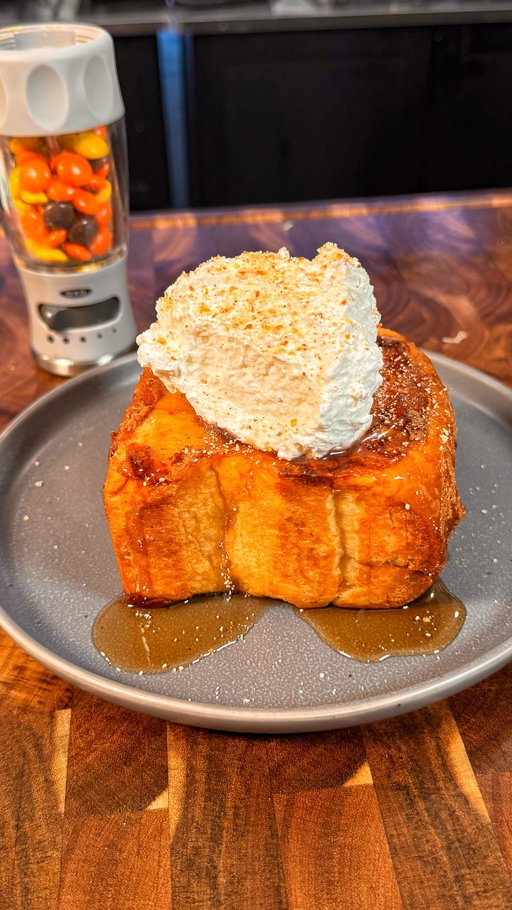 Reese’s Ice Cream French Toast

INGREDIENTS & RECIPE👇🏻
6 thick cut pieces of white bread (any thick bread will work as long as it’s thick enough to stuff with Reese’s Cups)
12 Reese’s Peanut Butter Cups
1 container of melted Reese’s ice cream 
1 cup crushed Reese’s pieces 
Maple syrup and whipped cream for garnish