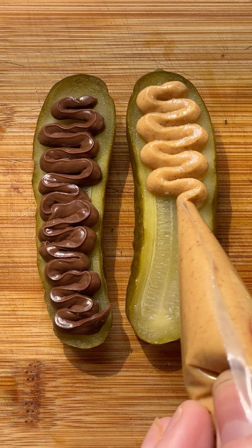 We’ve seen pickles wrapped in cheese, fried, battered… the internet has truly done the most with them. But this one stopped us in our tracks.

Inspired by @kaylinandkaylin , we HAD to try their sweet-salty pickle snack for ourselves. A pickle sliced in half, loaded with chocolate and peanut butter, then sandwiched together with pretzels for the crunch.

It’s briny, it’s sweet, it’s salty, it’s crunchy… and somehow it WORKS.

Tag someone you think would love this snack 😂