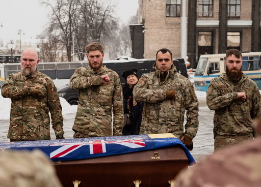Kyiv, Ukraine - At a snowy funeral in Kyiv two weeks later, Azov’s International Battalion gathers for the funeral of two more soldiers. The men gathered vary in ages from early 20s to late 40s, in races from Ukrainian, to Portuguese and American both North-and-South. They are indifferent to the unbandaged head wounds, the cast-bound legs and -17 degree weather but united in eyes filled with grief, hatred, and belief. 

Watch, Read and Listen to the full story on @frontsightofficial 

#Ukraine #russianinvasionofukraine #conflictjournalism #war #azov