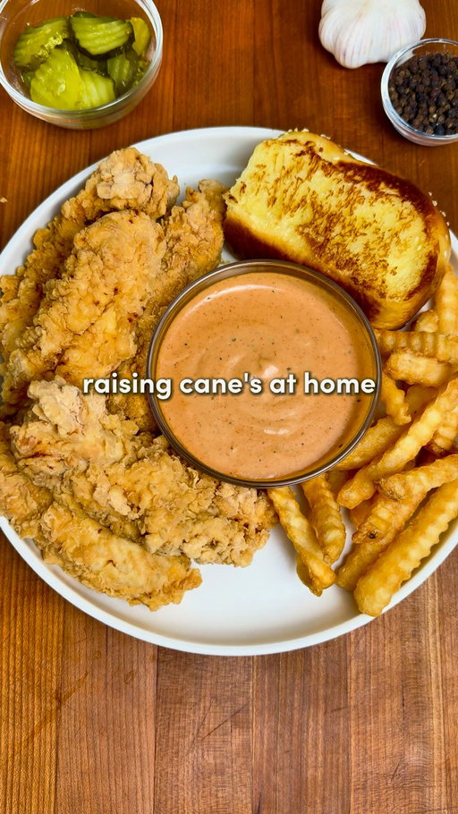 Raising Cane’s at Home 🐔🏠

Comment “Recipe” and I’ll send you the full recipe card for free!!

For ALL of you asking - the app link for Osta is in my bio or you can search “Osta Recipes” on the App Store or Google Play store ‼️🫶

Crispy buttermilk chicken tenders, addictive Cane’s sauce and fluffy texas toast… all at home! 

For the Chicken:
-2 lbs (0.9 kg) chicken breast, sliced into strips (or use tenderloins)
-2 cups buttermilk
-1/3 cup pickle juice
-Seasonings: 1 tsp garlic powder, 1 tsp paprika, 1 tsp onion powder, 1 tsp salt, 1 tsp black pepper
-Neutral oil, for frying
Flour Mixture:
-2 cups all-purpose flour +1/2 cup cornstarch
-1 tsp baking powder
-Seasonings: 2 tsp garlic powder, 2 tsp paprika, 2 tsp salt, 2 tsp black pepper
Cane’s Sauce
-1/2 cup mayonnaise
-1/4 cup ketchup
-2 tsp Worcestershire sauce
-Seasonings: 1 tsp garlic powder, 1 tsp onion powder, 1 tsp paprika, 1 tsp black pepper, 1 tsp seasoning salt

Instructions:
1. Slice the chicken breasts into strips about 1 inch thick and 3–4 inches long (roughly tender-sized).
In a bowl, whisk together the buttermilk, pickle juice, and chicken seasonings until fully combined.
Add the chicken and toss to coat. Cover and refrigerate for at least 2 hours, or overnight for extra tender chicken.
2. In a large bowl, combine the flour, cornstarch, baking powder, and flour mixture seasonings. Mix.
3. Add neutral oil to a large pot or deep skillet until it is about 2–3 inches deep. Heat the oil to 350°F / 175°C.  Keeping the oil around this temperature ensures crispy chicken without burning the coating.
4. Drizzle a little buttermilk marinade into the flour mixture and stir to create flaky, crispy bits. Shake excess marinade off the chicken, then coat each piece thoroughly in the flour mixture. Shake off any extra flour and gently place into the hot oil.
5. Don’t touch them for the first 1–2 mins, that’s how you get the perfect crust. Fry for 7–10 mins, or until golden brown and cooked through. Transfer the chicken to a paper towel-lined rack to drain.
6. In a bowl, combine all the sauce ingredients then refrigerate. 
7. Serve the chicken with a side of sauce, texas toast & crinkle fries… Enjoy :)
