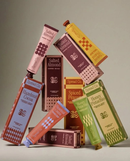 With Spread Co., the concept created by Atheria Studio explores what happens when gourmet nut spreads move from the traditional jar into aluminum tubes. ⁠
⁠
The shift feels perfectly timed as more brands experiment with this format, including recent examples like The Honey Department. Visually, the design pairs this modern format with a refined graphic language built around rich color blocks, vintage-inspired serif typography, and small repeating geometric patterns that echo classic confectionery and European pantry packaging. ⁠
⁠
Link in bio for the full article.