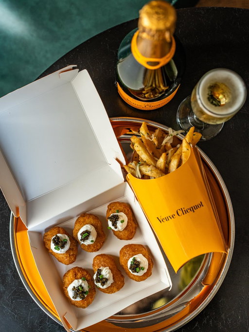 Coming soon to the Carousel Bar at the @hotelmonteleone: chicken nuggets + caviar + fries + @veuveclicquot 😮. #EatDrinkTravelYall🥂🍟✨