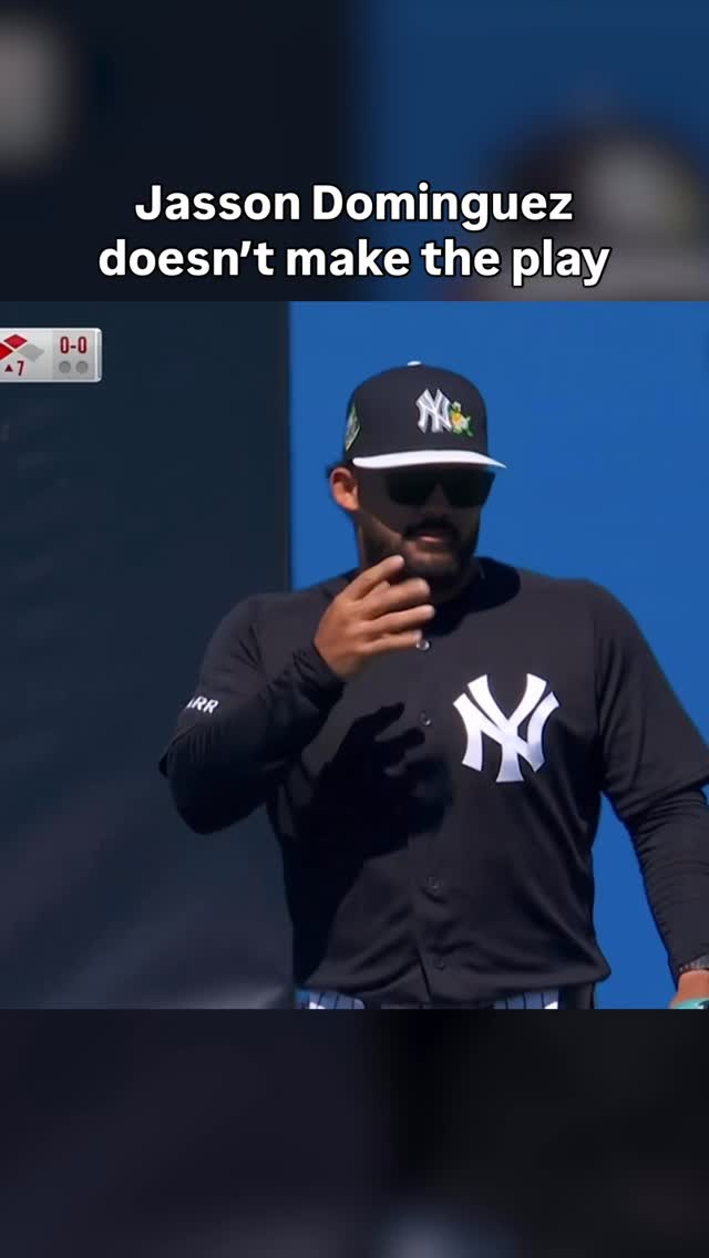 Jasson Dominguez can’t catch this high fly ball from Bryce Harper