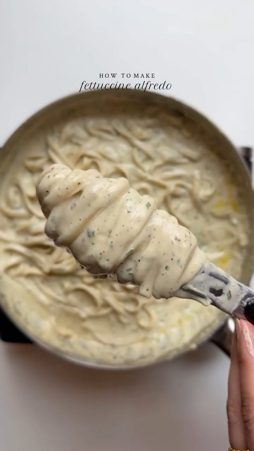 Fettuccine Alfredo 🍝 

Ingredients:

225g fettuccine
Salt to taste
1 tsp black pepper
1 tbsp garlic powder
1 tsp Italian seasoning
2 tbsp freshly minced parsley
1/2 cup butter
1 1/2 cup unsweetened heavy whipping cream
1 cup parmesan cheese
1 1/2 tbsp all-purpose flour
1 cup reserved pasta water

Method:

Bring a large pot of salted water to a boil. Cook the fettuccine according to package instructions until al dente. Reserve 1 cup of pasta water before draining.
In a large saucepan, melt the butter over medium heat.
Sprinkle flour over the butter mixture and whisk to combine. Cook for 1-2 minutes, stirring constantly.
Gradually pour in the heavy whipping cream, whisking continuously to prevent lumps. Bring the mixture to a simmer and cook for 2-3 minutes or until slightly thickened.
Remove the saucepan from the heat and stir in parmesan cheese until melted and smooth. Season with salt, black pepper, garlic powder and Italian seasoning.
Add the cooked fettuccine to the saucepan and toss to combine, adding reserved pasta water if needed to achieve a creamy consistency. Stir in freshly minced parsley and serve hot.

#recipe #alfredo #creamypasta #fettuccinealfredo