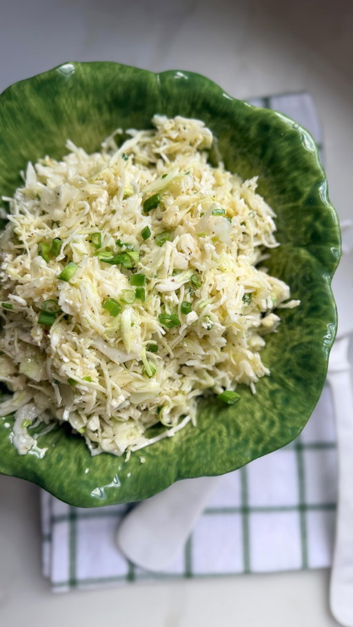Who remembers Zoe’s Kitchen?! A southern restaurant staple and my first job at age 14! Comment RECIPE for the ingredients and measurements for this easy feta slaw!

If you’d like additional details on my kitchen or outfit, just comment SOURCES and I’ll dm you the links 🔗