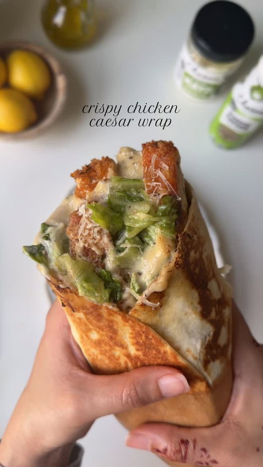 Crispy chicken Caesar wrap toasted to golden perfection using @chosenfoods avocado oil, mayonnaise, and Caesar dressing. #ChosenPartner
 
Ingredients 
 
For the chicken:
 
1 lb boneless chicken breast, halved lengthwise and pounded to even thickness 
Salt to taste 
1 tbsp garlic powder 
1 tsp smoked paprika powder 
1 tsp black pepper powder 
Chosen foods avocado Oil for frying 
 
For the dry batter:
 
1 cup all-purpose flour
2 tbsp corn starch 
Salt to taste 
1 tbsp garlic powder 
1 tsp smoked paprika powder 
1 tsp black pepper powder 
 
For the egg wash
2 eggs
1/4 cup water
 
For the panko breadcrumbs
 
2 cups panko breadcrumbs 
1 tbsp dried parsley 
 
For the Caesar sauce: 
 
1 cup mayonnaise 
1 tsp Worcestershire
1 tbsp garlic powder 
1/2 tsp black pepper 
Salt to taste
1 tbsp lemon juice, freshly squeezed 
1-2 tbsp extra virgin olive oil 
 
For the Caesar salad:
 
2 cup lettuce 
1/2 cup chosen foods Caesar dressing 
1/3 cup freshly grated Parmesan cheese 
 
To assemble:
4 large tortillas 
 
 
Method
 
Pat the chicken dry and lay them flat. Sprinkle salt, pepper, smoked paprika powder, and garlic powder evenly on both sides.
 
In a separate dish, mix all-purpose flour, corn starch, salt, pepper, smoked paprika powder, and garlic powder.
 
In another dish, whisk together eggs and water.
 
In a third dish, combine panko breadcrumbs and parsley.
 
Coat the chicken in the dry batter, then dip it into the egg wash, and finally coat it with the panko breadcrumbs.
 
Heat oil to 365°F and fry the chicken cutlets until they are golden brown and crispy, about 4-5 minutes or until the internal temperature reaches 165°F. Slice the chicken and set aside.
 
In a bowl, combine mayonnaise, Worcestershire sauce, olive oil, lemon juice, salt, pepper, and garlic powder.
 
In another bowl, make Caesar salad by combining lettuce, Caesar dressing, and Parmesan cheese. Mix to combine.
 
Assemble the wraps by taking a tortilla, adding the Caesar sauce, Caesar salad and chicken slices. Close the wrap and warm up for a bit. Serve warm and enjoy.

#caesarwrap #crispychicken #recipe