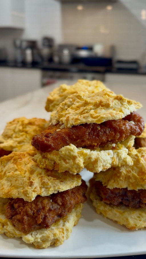 #ad #RedLobsterAtHome #CheddarBayYourWay
Hot honey fried chicken sliders on @redlobster Cheddar Bay Biscuits… yeah this right here is different 🔥

I took that Red Lobster Cheddar Bay Biscuit mix and ran it two ways… baked up soft buttery biscuits and worked it right into the chicken breading so every bite got that flavor built in.

Perfect for spring hosting or Easter weekend when you’re trying to show out without doing too much.

Hot Honey Fried Chicken Cheddar Bay Biscuit Sliders

Ingredients

For the Biscuits & Breading
2 boxes Red Lobster Cheddar Bay Biscuit Mix (one for biscuits, one for chicken breading)

Chicken
2–3 lbs chicken breast, cut into slider-sized portions
Oil, for frying

Chicken Brine / Seasoning
1 1/2 cups buttermilk
1/2 cup pickle juice
2 tablespoons hot sauce
1 egg
2 teaspoons Creole seasoning
2 teaspoons garlic herb seasoning

Hot Honey Sauce
1 cup honey
1 1/2 cups Louisiana hot sauce
2 sticks unsalted butter, melted

Instructions

Prepare the chicken by combining buttermilk, pickle juice, hot sauce, egg, Creole seasoning, and garlic herb seasoning in a large bowl. Add the chicken and mix until fully coated. Let it marinate for at least 1 hour, or overnight for best results.

Prepare one box of Red Lobster Cheddar Bay Biscuit Mix according to the package directions and bake. Set aside to cool slightly.

Pour the second box of biscuit mix into a bowl and use it as your seasoned breading. Dredge the marinated chicken in the mix, pressing to fully coat each piece.

Heat oil to 350°F and fry the chicken in batches until golden brown and cooked through, about 5–7 minutes. Transfer to a wire rack.

In a saucepan or bowl, combine honey, Louisiana hot sauce, and melted butter. Mix until smooth and glossy.

Dip or coat the fried chicken in the hot honey sauce.

Slice the Cheddar Bay biscuits in half and build your sliders with the hot honey fried chicken.

Serve immediately.