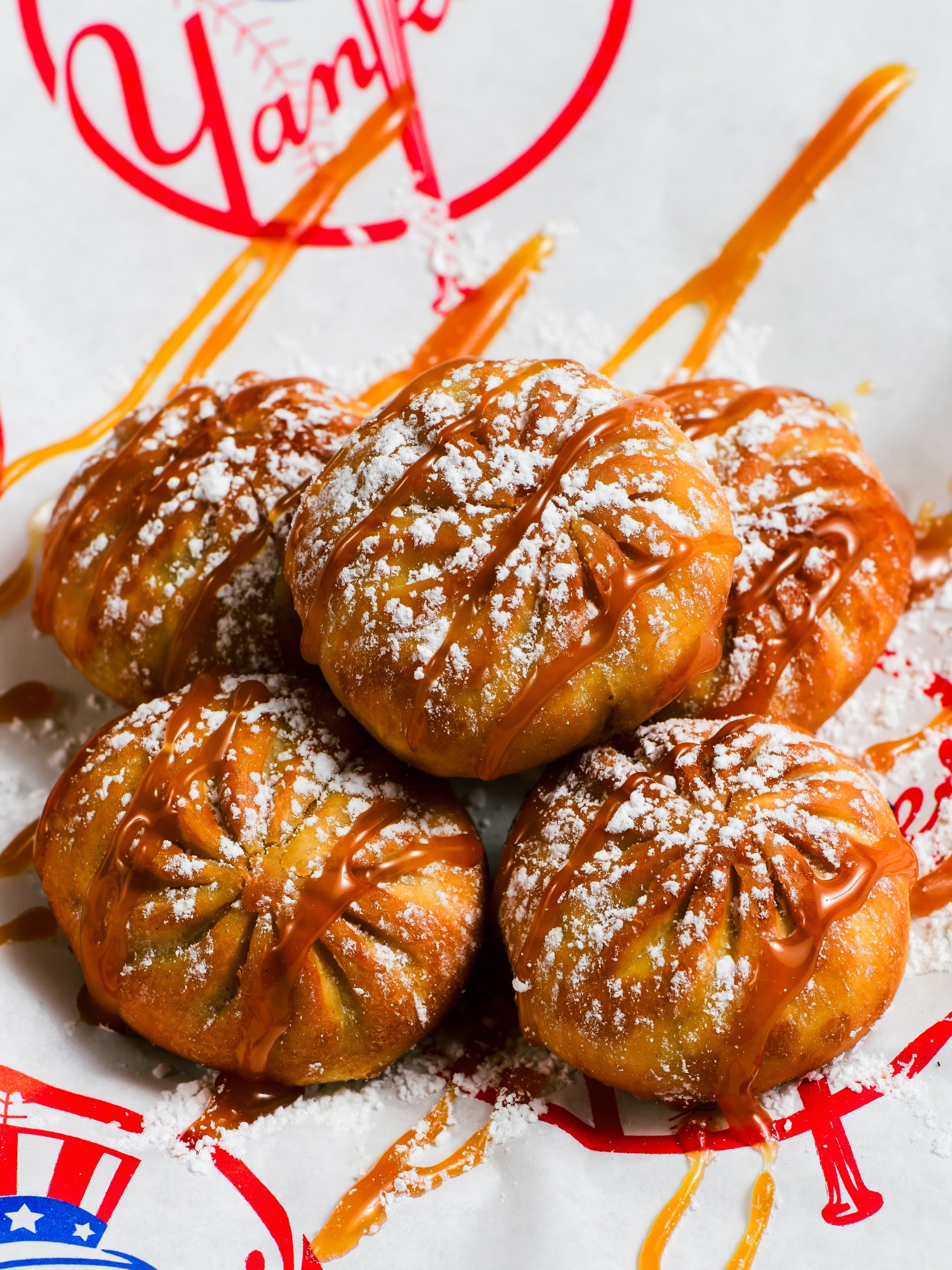 New Ballpark Bites & Drinks at @yankeestadium 🔥

📍Dumplings (Apple Pie, Bacon Cheeseburger, Chicken Parm, Mac & Cheese) | @brooklyndumplingshop - Sections 108, 213, 321, Bleachers

📍MVP Burger (Two 4 oz. American wagyu beef patties, American cheese, caramelized onions, onion rings, tomato-bacon jam, secret sauce, brioche bun, dill pickles) | Section 227

📍Pasta Plates (alla vodka, 8-hour marinara, arrabbiata), Antipasto Salad, Mozzarella en Carrozz, Affogato | @christianpetroni Parm to Table - Section 105

📍Angry Lobster Roll, Chicken Parm Sando, 99 Burger on a Pretzel Bun | @kingshawaiian - Sections 115, 334

📍Apple Pie Nachos | Mister Softee – Sections 110, 125, 217, 318

📍Bronxtail, Aspen Espresso Martini, The Heater, No-Hitter Mocktail | Stadium bar areas, various stands and social gathering locations

📍Pastrami Fries | @lobelssince1840 - Section 132

📍Mini Dessert “Chicken” Bucket (Drumstick shaped ice cream with a chocolate-covered cookie “bone” center, a coating of white chocolate and candied corn flakes served in a souvenir mini “chicken” bucket) | Sections 125, 318

📍Loaded Fries | @fuku - Sections 109, 205, 331

📍Blondies & Brownies | @MagnoliaBakery - Sections 110, 121, 125, 202, 211, 217, 223, 318, 320, 324

📍Artisanal crispy rice treats | @treathouseny – Sections 110, 121, 125, 202, 211, 217, 223, 318, 320, 324

📍Sticky Que Chicken Sandwich | @streetbirdnyc - Section 112

📍Diamond Deal (12 chicken tenders, fries, 4 souvenir Pepsi beverages on a souvenir tray all for $49.99) | Coming soon to Sections 107, 213 & 321

For the full concessions lineup visit: yankees.com/eats 😋