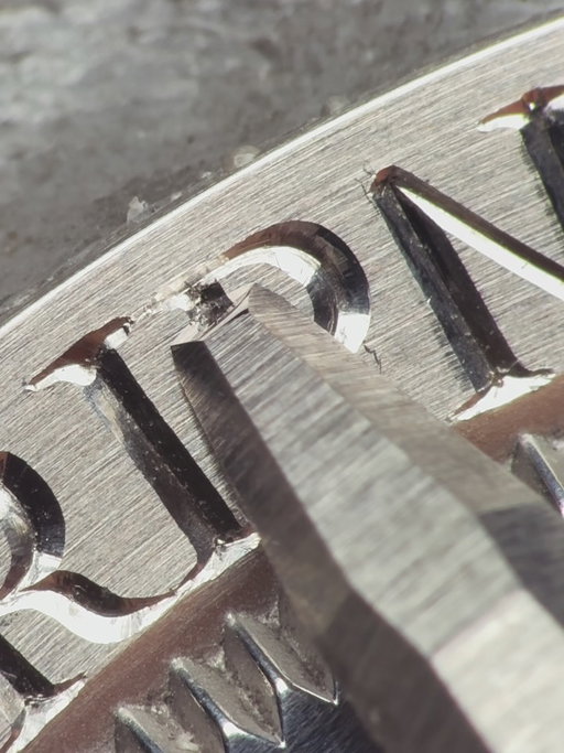 Process of engraving a Rolex stainless steel caseback for “The Bahamas” project. Featuring different cutting methods, metal treatment, and lettering - from deep relief lettering on the outer radius to lettering under 1 mm, such as the motto of The Bahamas.

This part of the engraving is designed to achieve its finest appearance through bright, polished cuts.