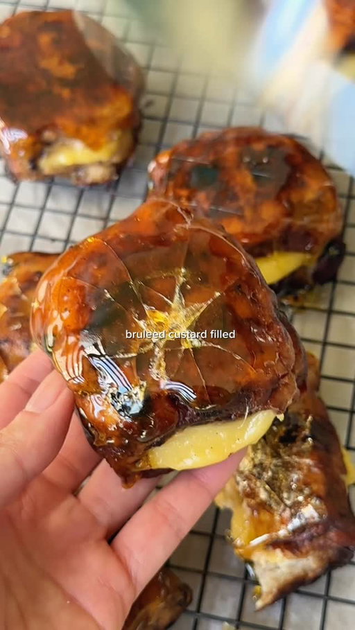 Bruleed custard-filled french toast hot cross buns 🍮

This is how you make hot cross buns party worthy with store bought hxb, custard powder & a sugar crack ✨

FRENCH TOAST SOAK
1 packet hot cross buns
3 eggs
225ml milk
30g sugar
1/2 tsp vanilla extract
50g butter

VANILLA CUSTARD FILLING
2 tbsp custard powder
2 tbsp sugar
1 1/2 cups milk
vanilla paste

BRULEE DIP
1 cup sugar
100ml water

1. Whisk eggs, milk, sugar and vanilla together. Place buns cut-side up in a deep dish, pour over the mixture and soak for at least 2 hours or overnight.
2. Melt butter in a pan on medium-high heat. French toast the buns 3 minutes each side until golden. Set aside.
3. For the custard, whisk custard powder and sugar with milk until smooth. Bring to a boil stirring continuously, then simmer until thick. Cool before piping.
4. Make an incision in each bun and pipe in the custard filling.
5. Combine sugar and water in a small pot and boil until light golden brown. Dip each filled bun into the caramel, transfer to a lined tray and allow to set.

#hotcrossbuns #easterrecipes #entertainingathome #easterbrunch #sydneyfoodie