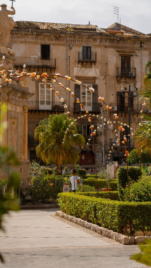 Don’t miss this bucket list city✨ FOLLOW @‌sinahsstories for more underrated travel inspo, guides & itineraries!

Often overlooked for Italy’s big mainland names like Rome or Tuscany, Palermo is pure Sicilian energy. And I loved everything about it. It’s truly a city where history meets everyday moments and you can definitely feel that.

It’s impossible not to feel the mix of cultures — Arab, Norman, and Italian — that shaped this city. You can walk in any direction and you’ll find mosaics, street art, and food that’s as bold as Palermo itself.  And the chaos is part of its magic.

My favorite places to see
🏛 Quattro Canti – the heart of Palermo, where four elegant baroque facades meet
🚶‍♀️ Via Vittorio Emanuele – the city’s main artery, lined with shops and churches
💦 Fontana Pretoria – the so called “Fountain of Shame”
⛪ Cattedrale di Palermo – an architectural masterpiece you need to see
🕌 Porta Nuova – the striking city gate with intricate detail
🌸 Chiesa del Gesù – breathtaking frescoes and gold‑leaf decor

Tips you need to know

- Don’t drive into the city: it’s best to find a parking spot outside the center.
- Be prepared for crowds around Via Vittorio Emanuele
- Embrace the vibe: a bit of chaos is part of Sicily’s charm, and nowhere captures it better than Palermo.

How to get there
Fly into Palermo Falcone–Borsellino Airport and reach the center in about 40 minutes by car or shuttle.

How long to stay
Spend at least four to five days to experience both the city’s pulse and its slower, seaside towns like Cefalù or Terrasini.

✨Hi, I’m Sinah and I love sharing travel tips that are actually useful: the little underrated spots, easy ways to see a place, and the kind of things that make a trip feel magical, plus guides and itineraries that help you explore the places. FOLLOW along for more!