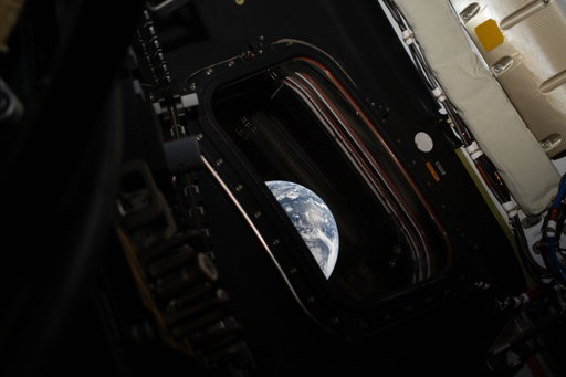 New photos from space dropping NOW.
 
Pause for a moment with the crew of @NASAArtemis II as they look back at our home planet, seen through the window of the Orion capsule. That’s us, together, looking back at the astronauts journeying to the Moon, for all of humanity.
 
In the first image, Earth peeks through the capsule window, reminding us that a view like this relies on the ingenuity and hard work of countless people back home.
 
In the second image, we see our home planet as a whole, lit up in spectacular blues and browns. A green aurora even lights up the atmosphere in the north.
 
Image descriptions:
1: One-third of Earth peeking through the window of the Orion capsule. The planet is a dreamy pale blue, swirling with white clouds and reflected sunlight. Although Earth only fills a fraction of the image it is the brightest object in the image by far. The capsule window is surrounded by a thick frame held in place with bolts, reminiscent of a heavy duty airplane window. It is dark in the capsule, but the outlines of straps and various components of the capsule are visible. Brighter white components are visible in the upper right corner. Credit: NASA

2: A full disk image of Earth, as seen from the Orion capsule. The planet is a pale blue, swirling with white clouds and glowing slightly lighter blue in place from reflected light. From about 8 to 9 o’clock, a large brown landmass is Africa, with the Iberian peninsula twinkling with lights just where the planet curves. At the 1 o’clock spot, aurora glow in a thin green glow, just barely separated from the planet’s surface. Earth is set against the black of space. Credit: NASA