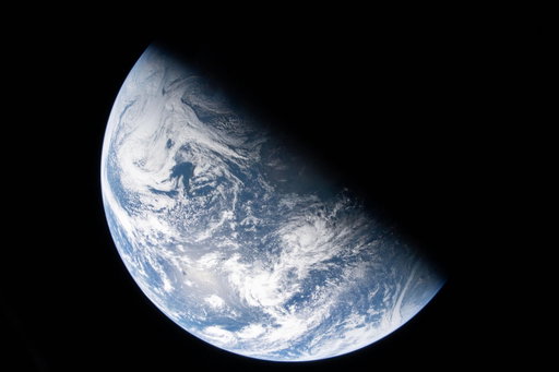 More new Earth images dropped! 🤩
 
In this new image from the Artemis II crew, we see the divide between night and day, known as the terminator, cutting across Earth. Whether awake or fast asleep, we’re all here on this planet together. 
 
In the second image, also taken from the Orion capsule, we can see ourselves represented by the electric lights of human activity. In the lower right, sunlight illuminates the limb of the planet. 
 
The Artemis II crew’s schedule is designed around the requirements of the mission. While many in the U.S. were preparing for bed on April 2, the crew had just completed translunar injection, putting them officially on course for the Moon. 
 
Credit: NASA

Image descriptions:
1: Earth as seen from the Orion capsule. It is divided sharply in half, with a line running diagonally from the 11 o'clock to the 4 o'clock. The lower left half is a bright pale blue. Its surface is covered with swirly, puffy white clouds, with texture indicating different thicknesses. The upper right half is dark, with no illumination from the Sun. Earth is set against the black of space.

2: A full disk image of Earth at night, as seen from the Orion capsule. The planet is a dark midnight blue. Swirling white clouds are visible against the darker surface. From about 8 to 9 o'clock, a large, very brown landmass is Africa, with the Iberian peninsula twinkling with lights just where the planet curves. Other tiny yellow dots of electric lights are sprinkled across the planet's surface. From the 3 to the 6 o'clock spot, a very thin crescent of blue light hugs the edge of the planet. Earth is set against the black of space.