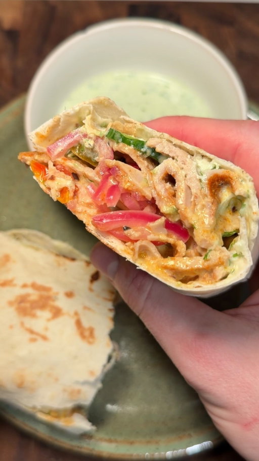 Chicken Shawarma Wrap 🌯🔥✨ 
(via: @chefboyar.ben)

The post-gym wrap you could eat every single day. Seasoned ground chicken rolled and baked until juicy, loaded into warm lavash with homemade tzatziki, pickled onions, roasted tomatoes, and spicy jalapeños. Simple, protein-packed, and absolutely crave-worthy. Save this for your next easy dinner. 🤍

🛒 Ingredients
For the Chicken
* 1 lb ground chicken
* Paprika
* Chili powder
* Garlic powder
* Salt
* Black pepper
For the Tzatziki
* Greek yogurt
* Persian cucumber, grated
* Fresh dill, chopped
* Olive oil
* Roasted garlic
* Salt
* Black pepper
For the Pickled Onion
* 1–2 red onions, thinly sliced
* 2 cups white vinegar
* 2 cups water
* 2 tbsp honey
For Toppings
* Persian cucumber, sliced
* Cherry tomatoes, roasted
* Sweet and spicy jalapeños
* Lavash bread or wrap of choice

👩‍🍳 Directions
1. Preheat oven to 400°F. Place the ground chicken on foil or parchment paper, cover with another sheet, and roll out until evenly thin. Season generously. Roll up tightly and cut in half to fit in a baking pan.
2. Place the wrapped chicken on a pan alongside cherry tomatoes and a head of garlic with the top chopped off. Drizzle with olive oil and season with salt. Bake for 40–45 minutes.
3. For the pickled onions, thinly slice red onions and pack into a jar. Bring vinegar, water, and honey to a simmer. Turn off the heat, let cool for a minute, then pour over the onions. Let sit at room temp for 15 minutes, then refrigerate.
4. Once the chicken is done, let it cool slightly. Smash the roasted garlic and mix with Greek yogurt, grated cucumber, chopped dill, olive oil, salt, and pepper for the tzatziki.
5. Build your wrap with lavash bread, tzatziki, sliced chicken, pickled onions, roasted tomatoes, cucumber, and jalapeños. Sear in a pan to seal and warm through.

Juicy, loaded, and the ultimate post-gym wrap. 🤍

Subscribe to @EatingHealthyToday for exclusive recipes, viral meal ideas & daily food inspiration you won’t find anywhere else! 🍽️✨

#healthyrecipes #chickenshawarma #highprotein #dinnerideas #foodinspiration