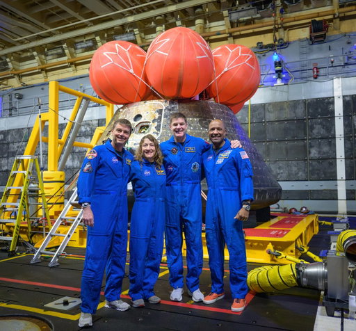 The astronauts. Their ride around the Moon. 
 
The Artemis II astronauts pose for a group photo after viewing their Orion spacecraft — which they named Integrity — in the well deck of USS John P. Murtha following their splashdown. 

Image description: NASA astronauts Reid Wiseman (@Astro_Reid), commander; left, Christina Koch (@Astro_Christina), mission specialist; CSA (@CanadianSpaceAgency) astronaut Jeremy Hansen (@AstroJeremy), mission specialist; and NASA astronaut Victor Glover (@AstroVicGlover), Artemis II pilot, right, pose for a group photo after viewing the Orion spacecraft in the well deck of USS John P. Murtha, Saturday, April 11, 2026, in the Pacific Ocean off the coast of California. 

Credit: NASA/Bill Ingalls