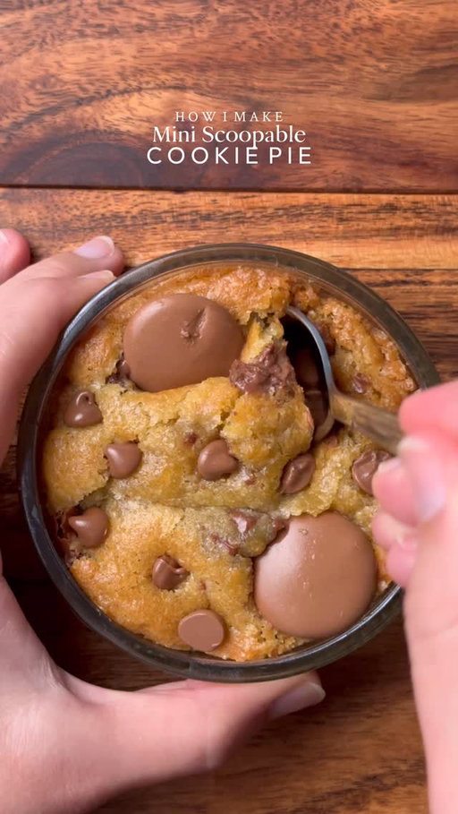 Ooey-Gooey Mini scoopable Cookie pie🤤
🤤

Yields: 7-8 mini Cookie pies 
INGREDIENTS:
•115g cold chopped unsalted butter
•80g caster sugar
•80g light brown sugar
•220g chocolate chunks or chips( you can increase or reduce this according to your preference) 
•238g plain flour 
•½ tsp salt
•1 & ½ tsp baking powder
•¼ tsp baking soda
•1 whole egg + egg yolk 
•½ tsp vanilla
•Nutella 
INSTRUCTIONS:
•In a large mixing bowl, add the cold cubed butter and whisk until slightly creamy. Add the white sugar and light brown sugar, then whisk together until well combined and fluffy.
•Add the eggs, vanilla extract, and chocolate chips or chunks. Whisk until fully incorporated.
•Add the flour, baking powder, baking soda, and salt. Gently mix until just combined, do not overmix.
•Preheat oven to 175-180°C (350°F).
•Take any shape mini baking dish circle, square, rectangle anything and Place the cookie dough and then add Nutella and another layer of cookie dough. 
•Bake for 15-20 minutes (timing depends on the type of dish) or until the tops are lightly golden while the centres remain soft and gooey.
•Remove from the oven and let cool slightly.
•Serve warm with ice cream and chocolate sauce enjoy!✨
NOTE: Store any extra dough balls in an airtight container or freezer bag and freeze for later. Whenever a cookie craving hits, bake straight from frozen 🫶🏻

#cookie #chocolate #nutella #fyp #explorepage
