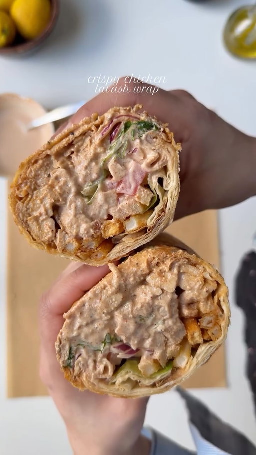 Crispy Chicken lavash wrap 🌯 

Ingredients 

For the chicken:
2 lb boneless chicken breast, cut into cubes 
Salt to taste
1 tsp black pepper 
1 tbsp garlic powder 
1 tsp onion powder 
1 tbsp smoked paprika powder 
1 tsp red chili powder 
2 tbsp oil ( for marinating )
2 tbsp lemon juice 

For the sauce 

1/2 cup mayonnaise 
1/3 cup sour cream 
1/3 cup butter milk
1 tbsp lemon juice 
Salt to taste
1 tbsp garlic powder 
1 tsp smoked paprika powder 
1/2 tsp black pepper 

To Assemble:

Lavash bread 
1 cup onions, diced
1 cup tomatoes, diced and seeded 
1 cup lettuce 
French fries
1 cup mozzarella cheese, optional 

Method:

In a large bowl, combine the chicken with salt, black pepper, garlic powder, onion powder, smoked paprika, red chili powder, oil, and lemon juice. Mix well so the chicken is evenly coated. Cover and let it marinate for at least 30 minutes (or up to overnight in the refrigerator for deeper flavor).

Heat a pan or grill over medium-high heat.
Cook the marinated chicken for about 5–7 minutes per side, or until fully cooked and slightly charred on the outside.

In a bowl, whisk together mayonnaise, sour cream, buttermilk, lemon juice, salt, garlic powder, smoked paprika, and black pepper.
Mix until smooth and creamy. Taste and adjust seasoning if needed. Chill until ready to use.

Lay a piece of lavash bread flat on a clean surface. Spread a generous amount of sauce over the center. Add cooked chicken, onions, tomatoes, lettuce, and French fries. If using, add mozzarella cheese. Drizzle a little extra sauce on top.

Fold in the sides, then roll tightly like a burrito. Drizzle some oil . Toast the wrap in a pan for 1–2 minutes on each side to make it crispy and help seal it.

 
#recipe #chickenwrap